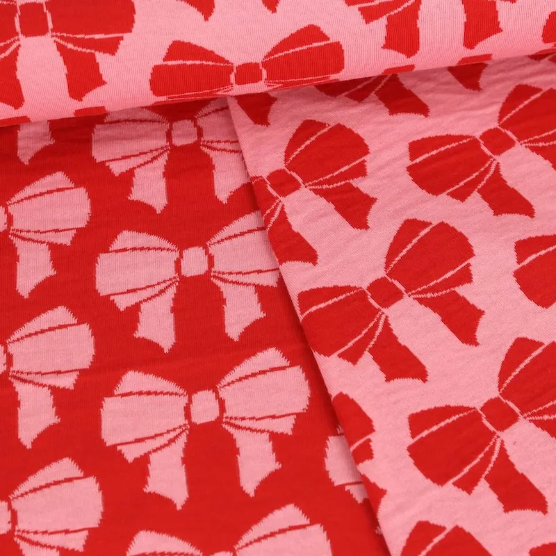 Organic Cotton Reversible Jaquard Fabric with Bows in Pink and Red