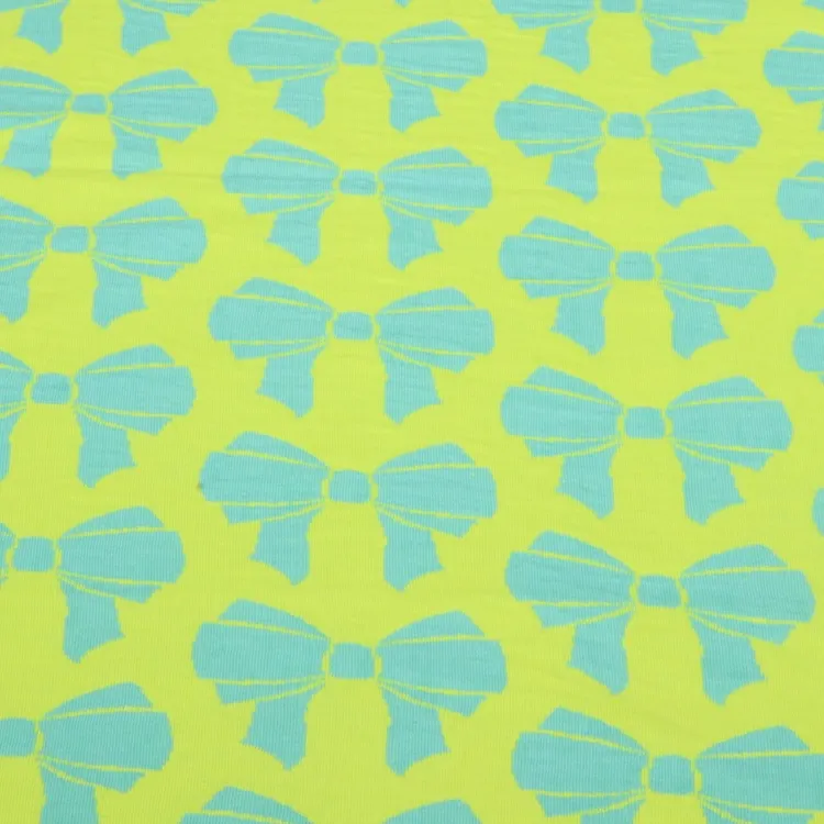 Organic Cotton Reversible Jaquard Fabric with Bows in Sky Blue and NeonYellow