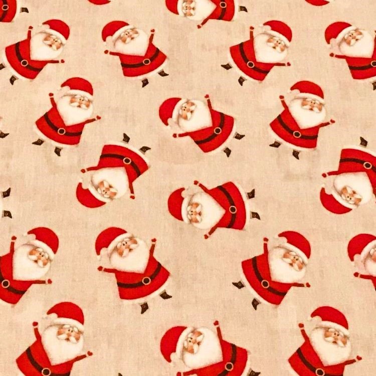 Cotton Poplin Fabric with Tossed Santas On Beige