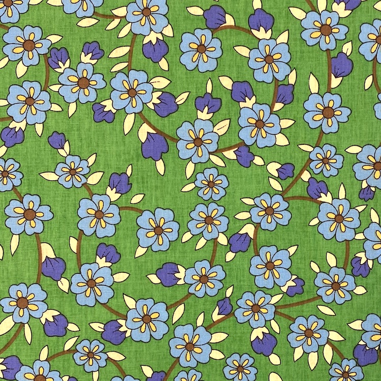 Cotton Poplin Fabric with Blue Flowers on Vines on Green