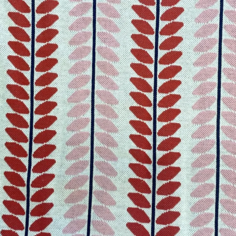 Organic Cotton Jaquard Fabric with Pink and Red Leaves on Stems