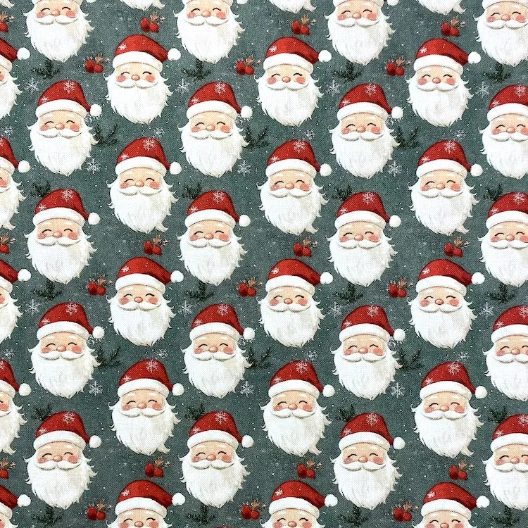 Quilting Fabric - Santa Heads on Green by John Louden